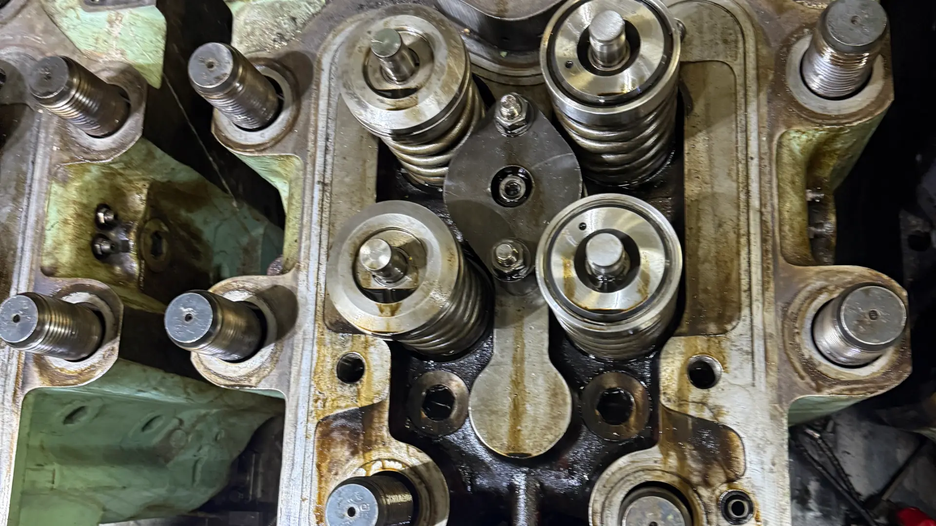 Close view of a marine engine cylinder head with valves and injector fitted